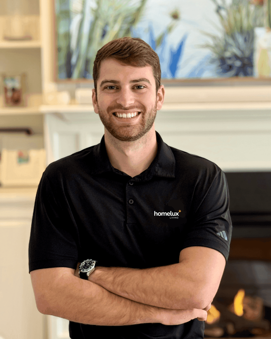 Homelux Living specialist in a branded polo, arms crossed and smiling