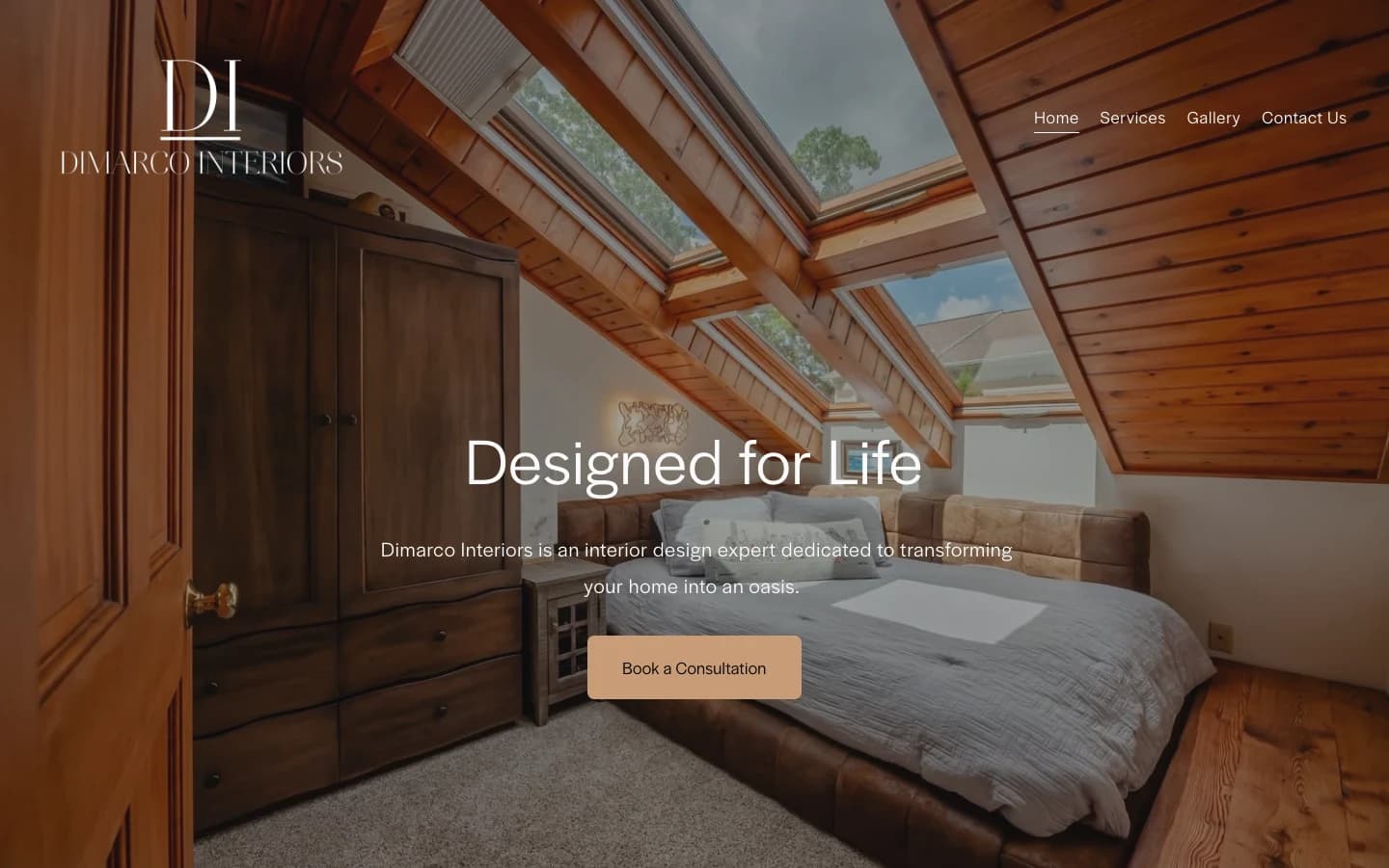 DiMarco Interiors homepage hero: 'Designed for Life' over an attic bedroom with a 'Book a Consultation' button