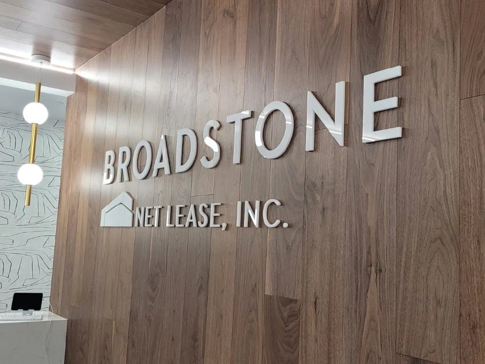 Broadstone Net Lease dimensional letters on a wood wall